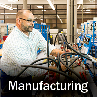 Man working with manufacturing equipment 